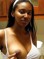 Amateur ebony hottie showing titties.